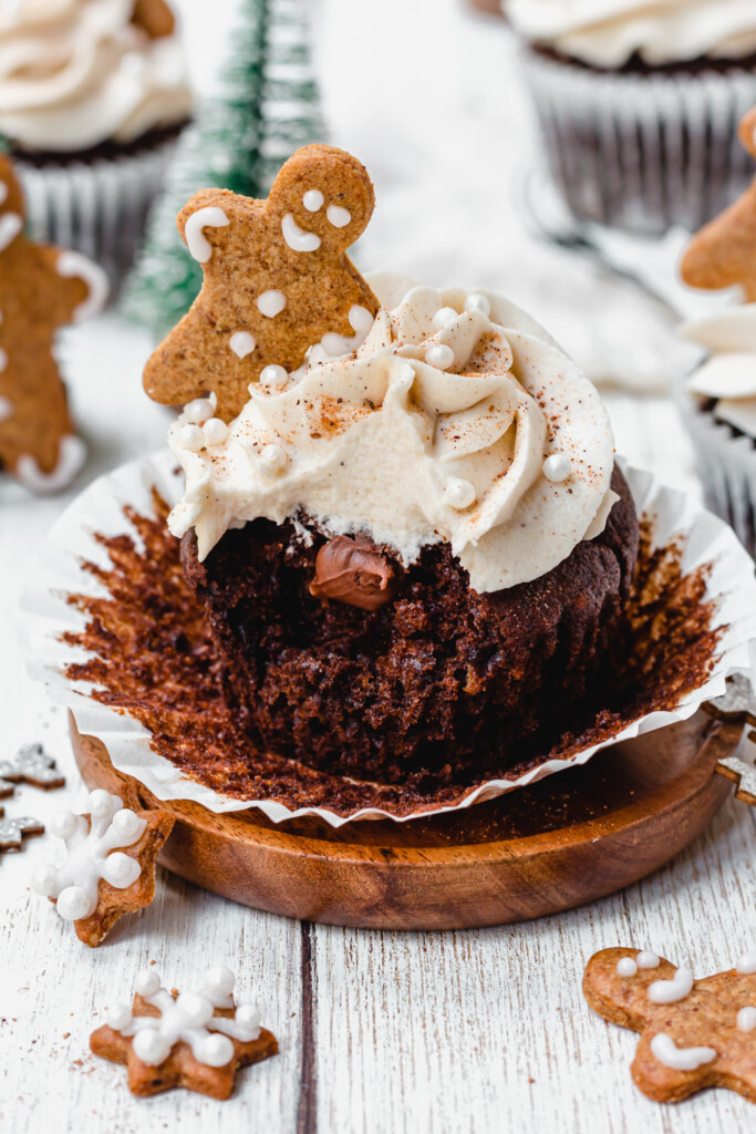 A bitten Chocolate Gingerbread Cupcake with a chocolate middle
