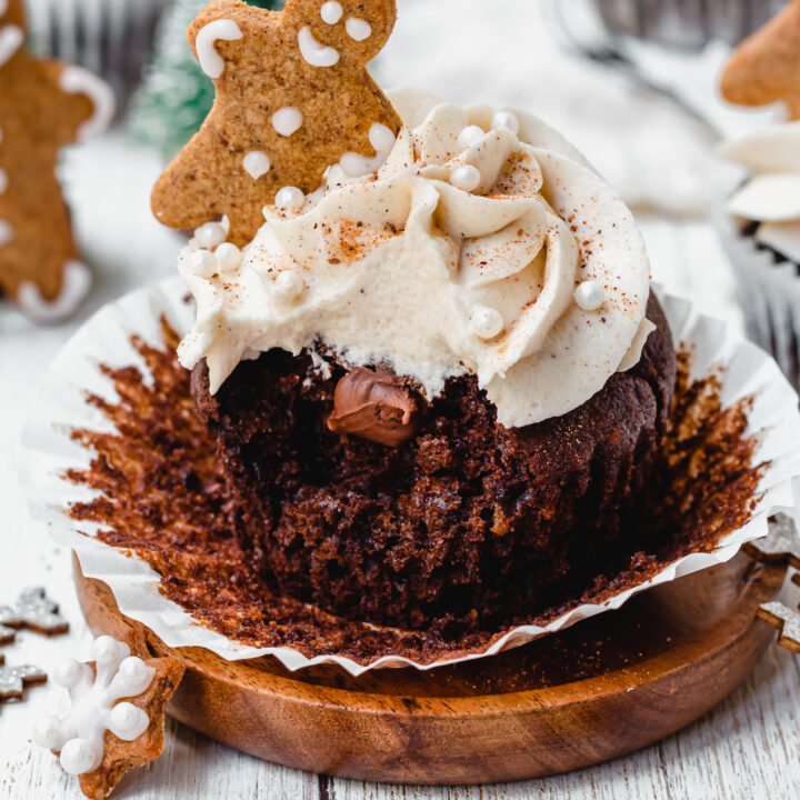 A bitten Chocolate Gingerbread Cupcake with a chocolate middle