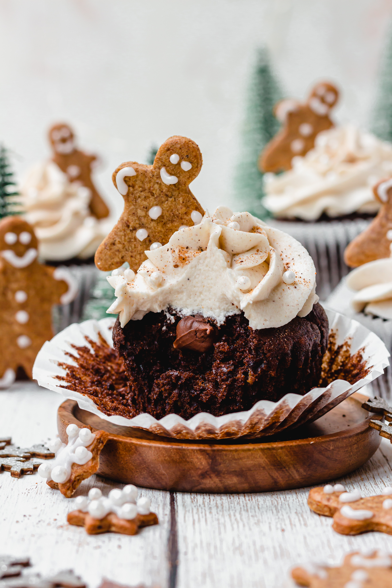 One Chocolate Gingerbread Cupcake on a wooden plate
