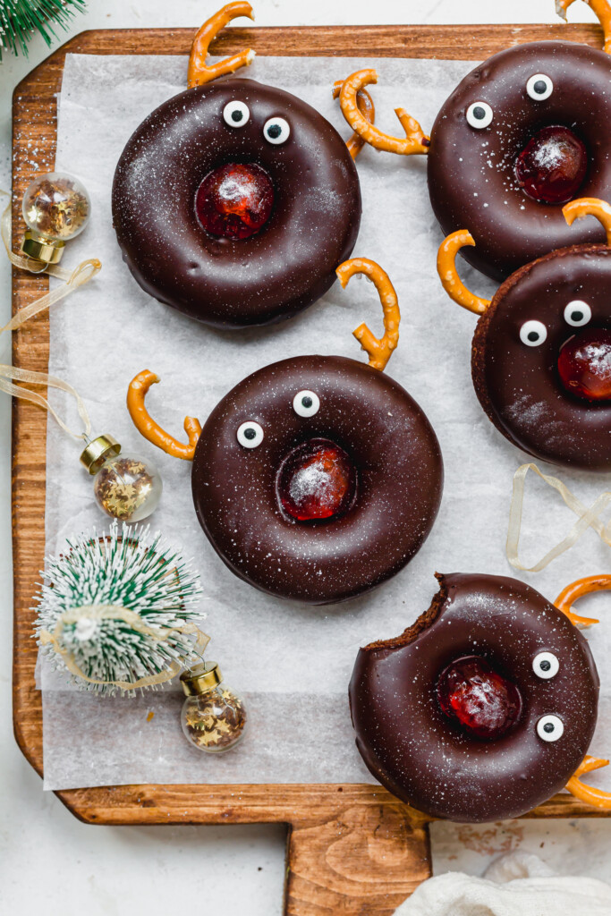 Some Reindeer Chocolate Doughnuts on a wooden board