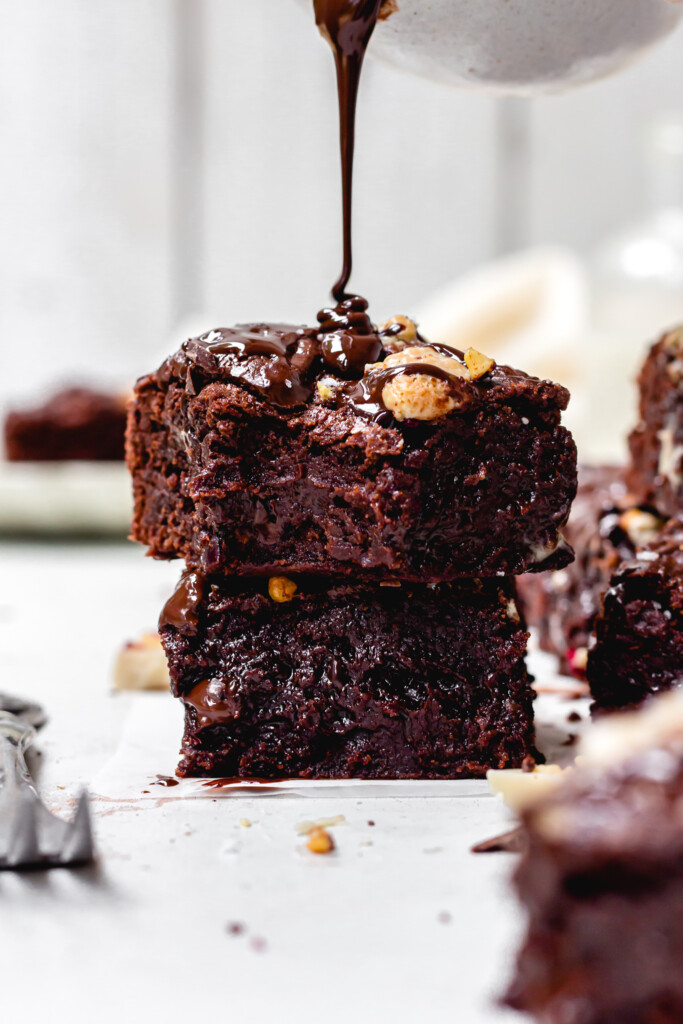 Drizzling chocolate over Triple Chocolate Fudge Brownies