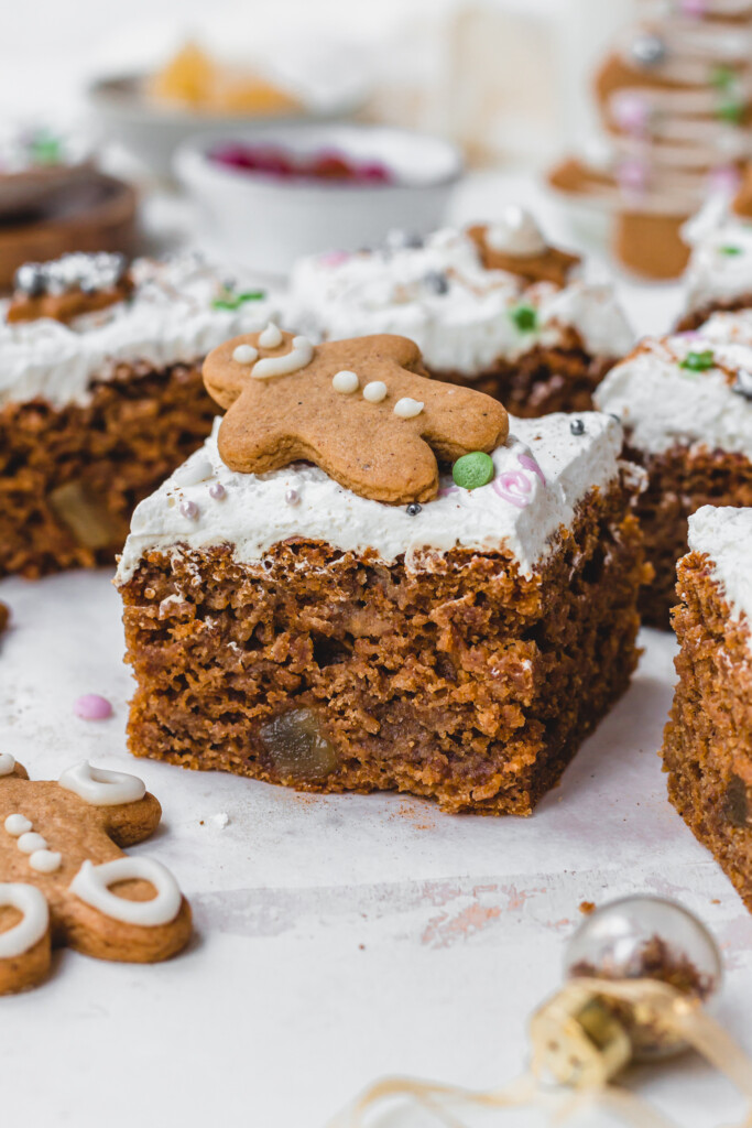 A square of Vegan Gingerbread Sheetcake with a gingerbread man