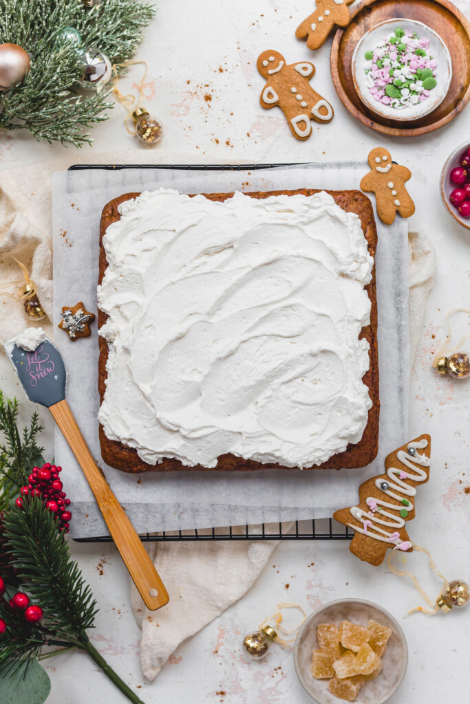 A gingerbread cake topped with vegan whipped cream