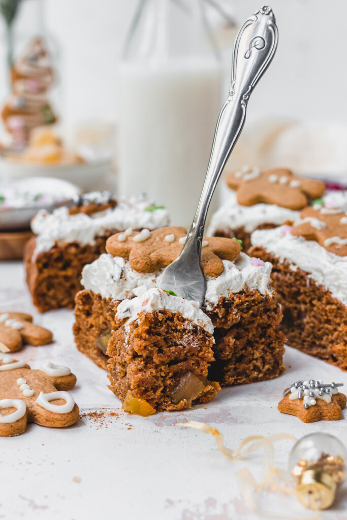 A piece of Vegan Gingerbread Sheetcake with a fork standing up