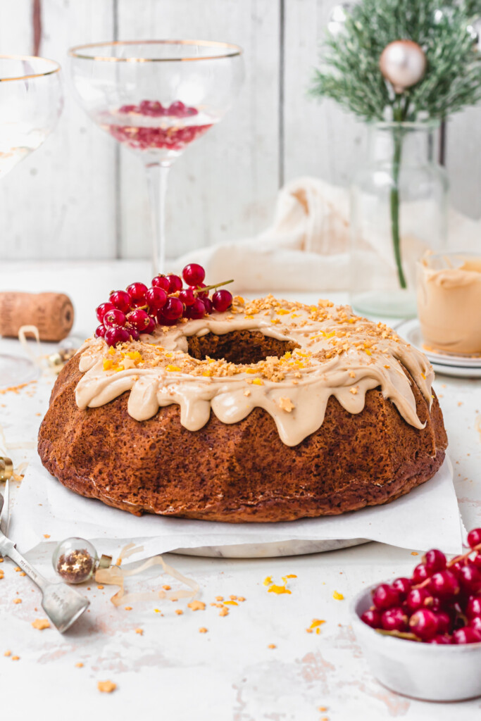 Vegan Orange Champagne Bunt Cake with redcurrants and sprinkles