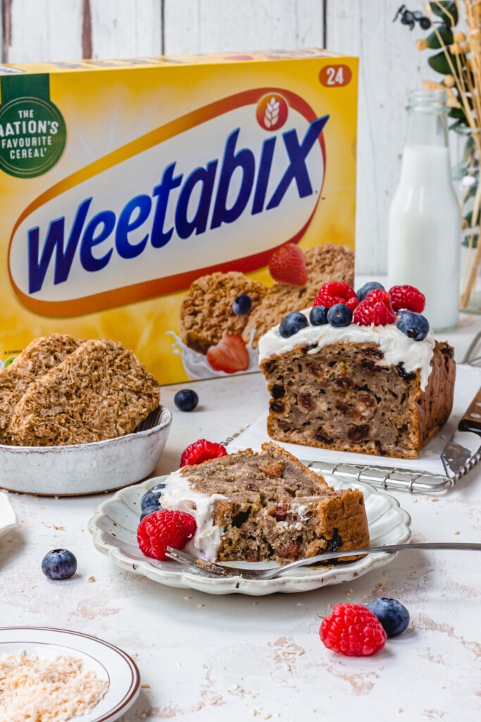Vegan Weetabix Cake with a pack of Weetabix in the background