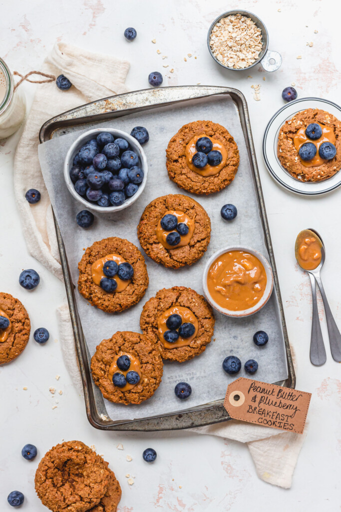 Peanut Butter and Blueberry Breakfast Cookies with a bowl of peanut butter and blueberries