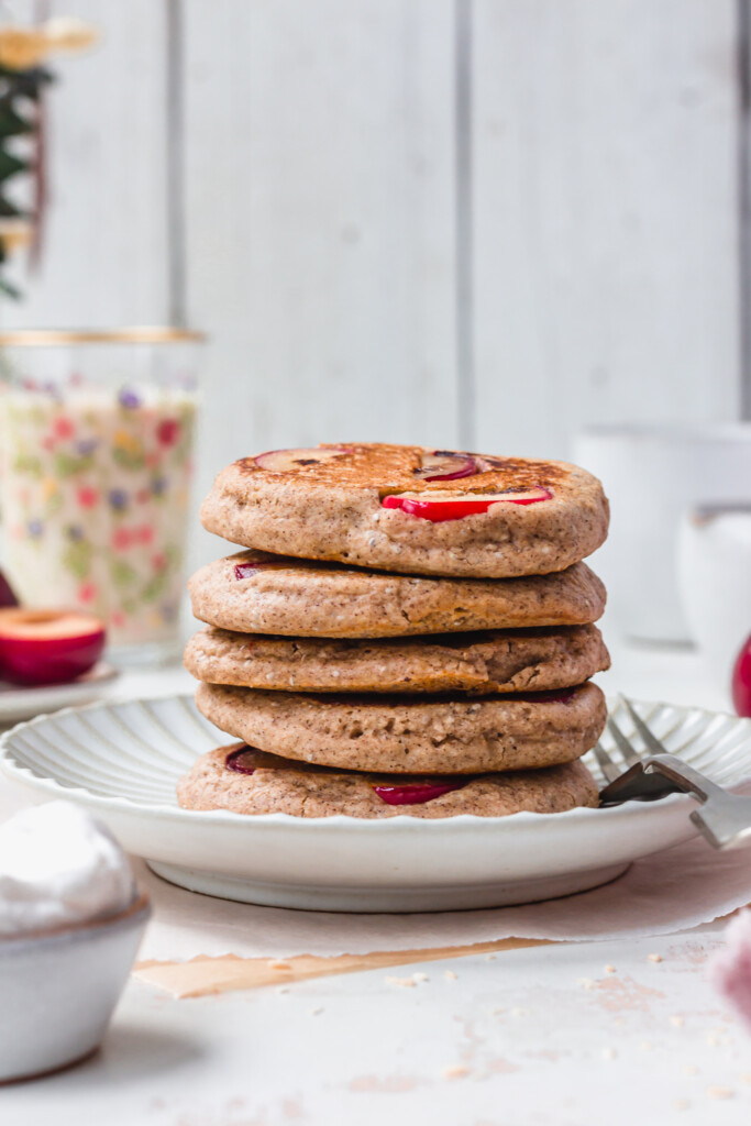 A stack of five Sticky Maple Plum Pancakes