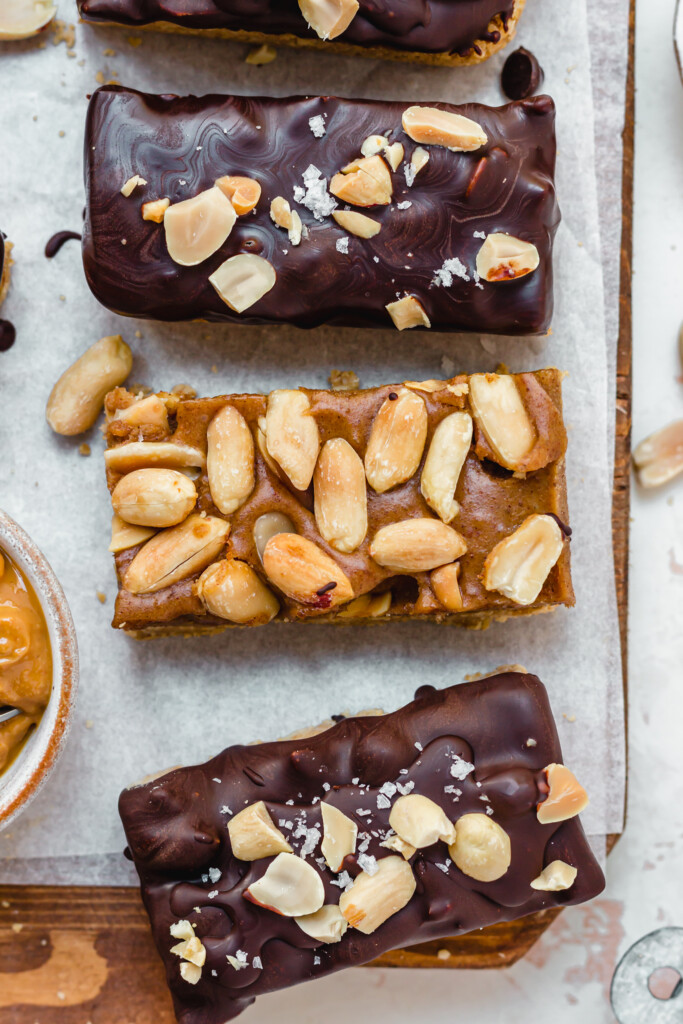 A peanut topped caramel bar surrounded by Vegan Protein Snickers