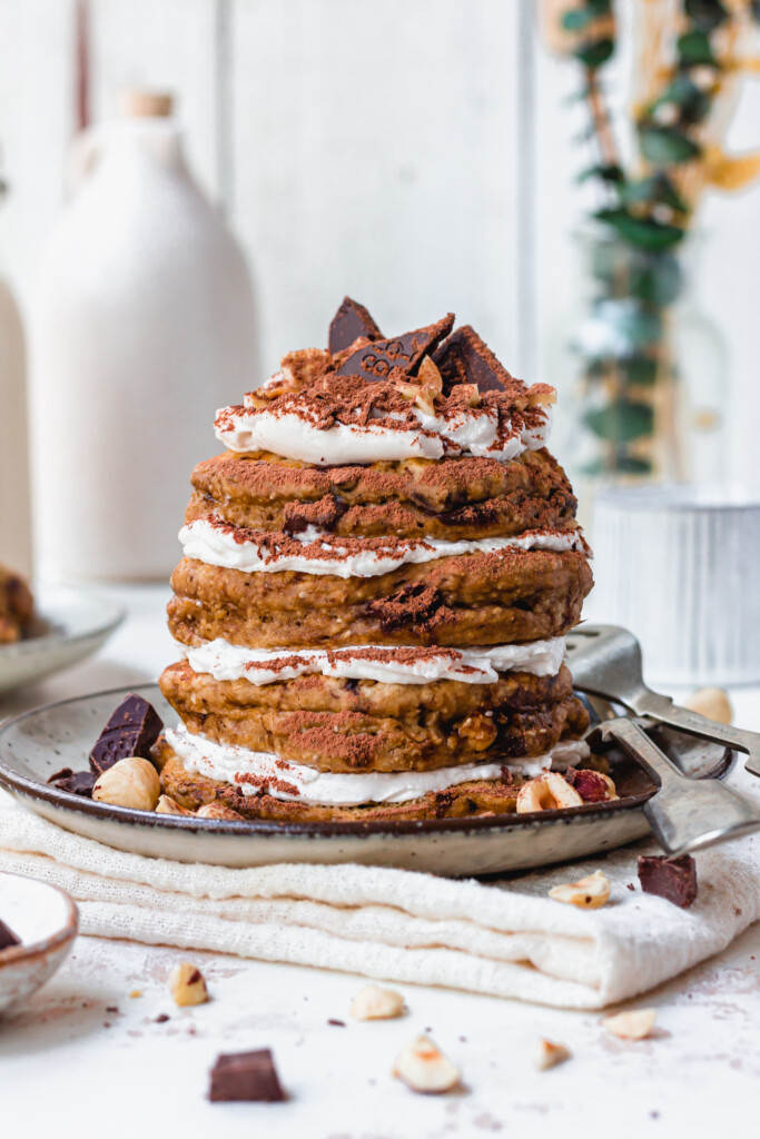 A stack of four Chocolate Hazelnut Tiramisu Pancakes with a fork