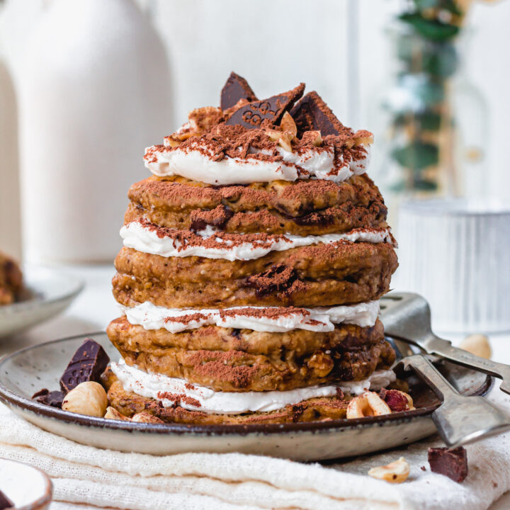 A stack of four Chocolate Hazelnut Tiramisu Pancakes with a fork