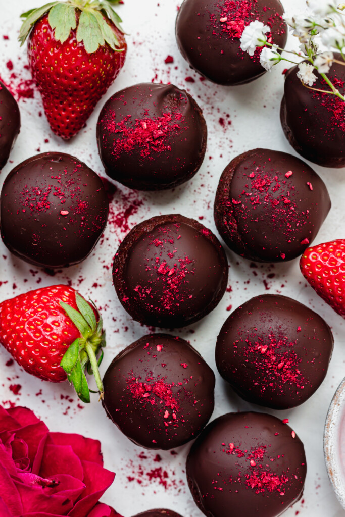 Lots of Chocolate Strawberry Truffles with strawberries and flowers
