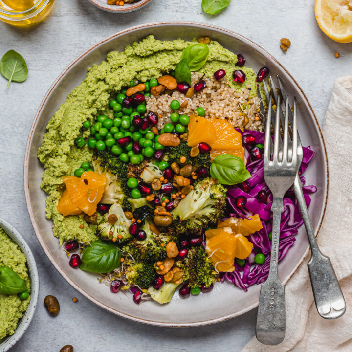 A Roasted Broccoli Pea and Quinoa Bowl with two forks