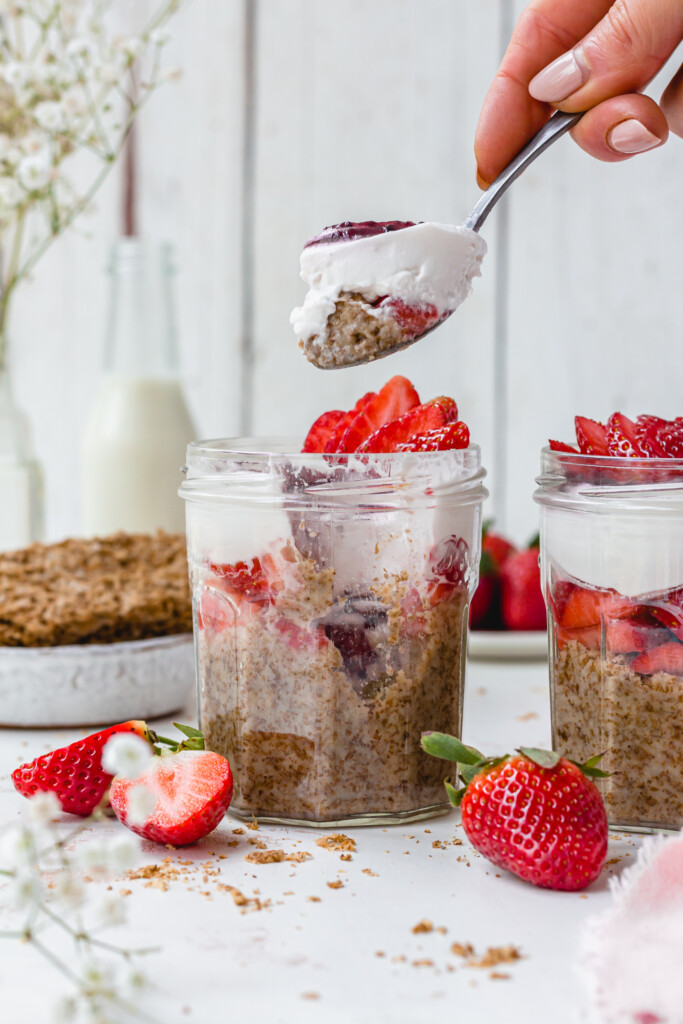 Lifting a spoon of Strawberry Overnight Weetabix from a jar