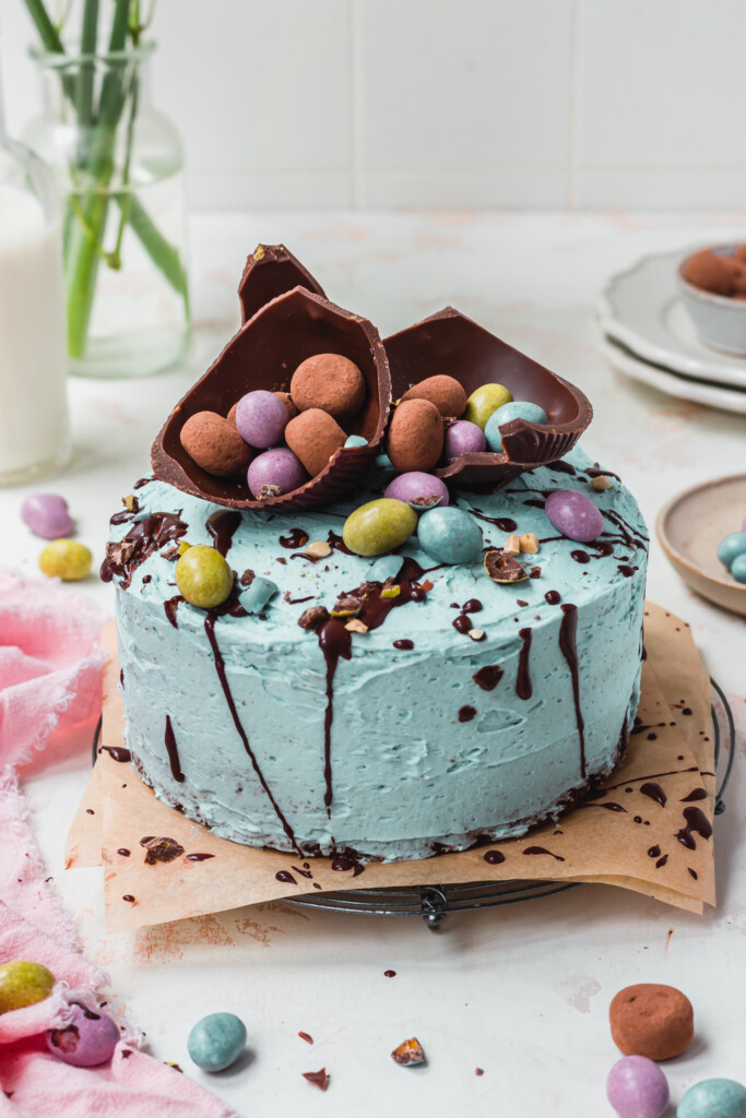A Chocolate Banana Easter Speckle Cake on a metal wire rack