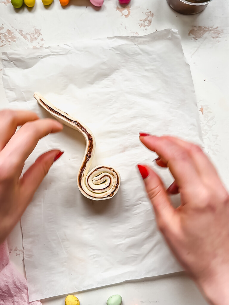 A swirl of chocolate filled pastry with a loop
