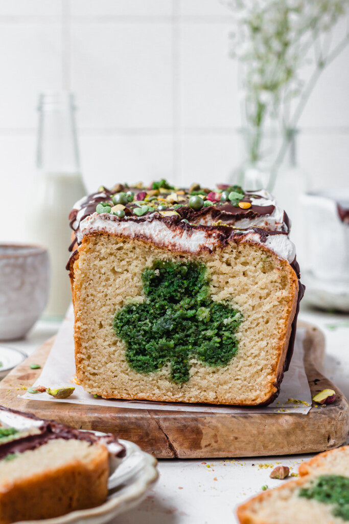 A loaf cake for St Patrick's Day with whipped cream on top