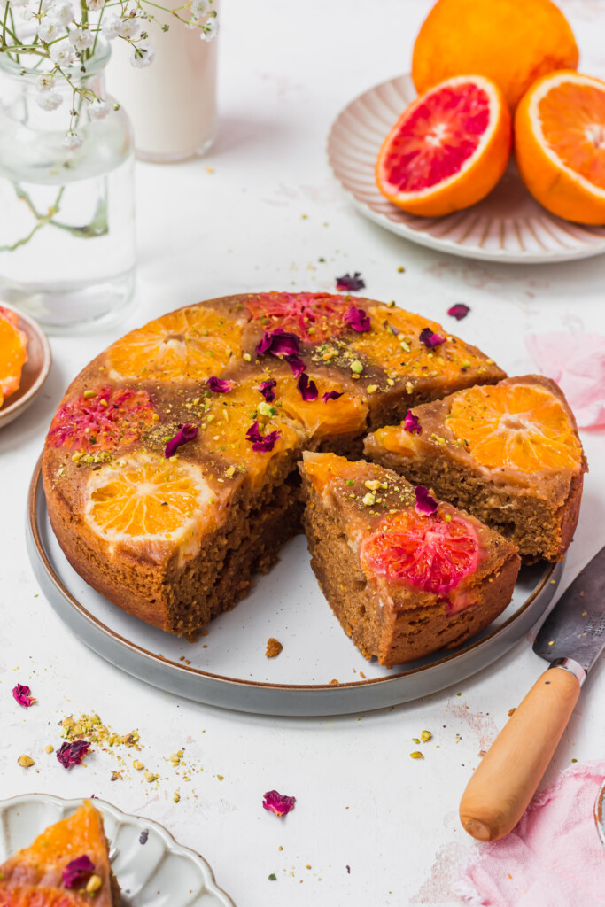 Two slices of cake cut from a Upside Down Vegan Blood Orange Cake