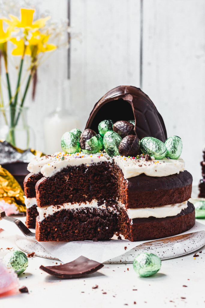 A Dark Chocolate Easter Egg Cake with slices cut out
