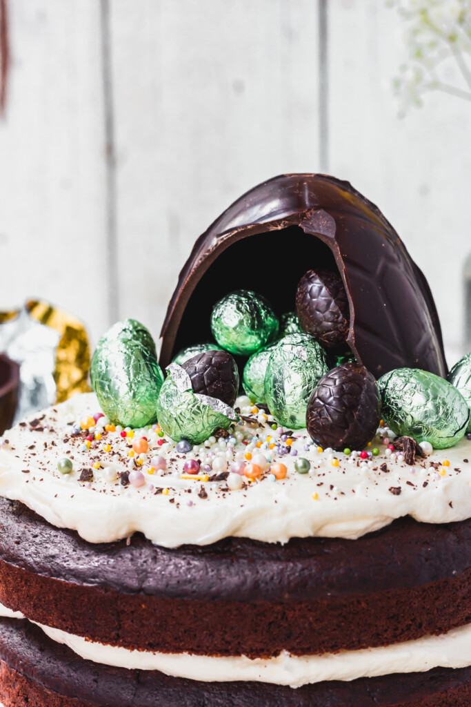 A cracked Easter egg on top of a Dark Chocolate Easter Egg Cake