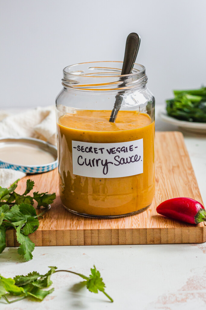 A glass jar of Vegetable Packed Vegan Curry Sauce