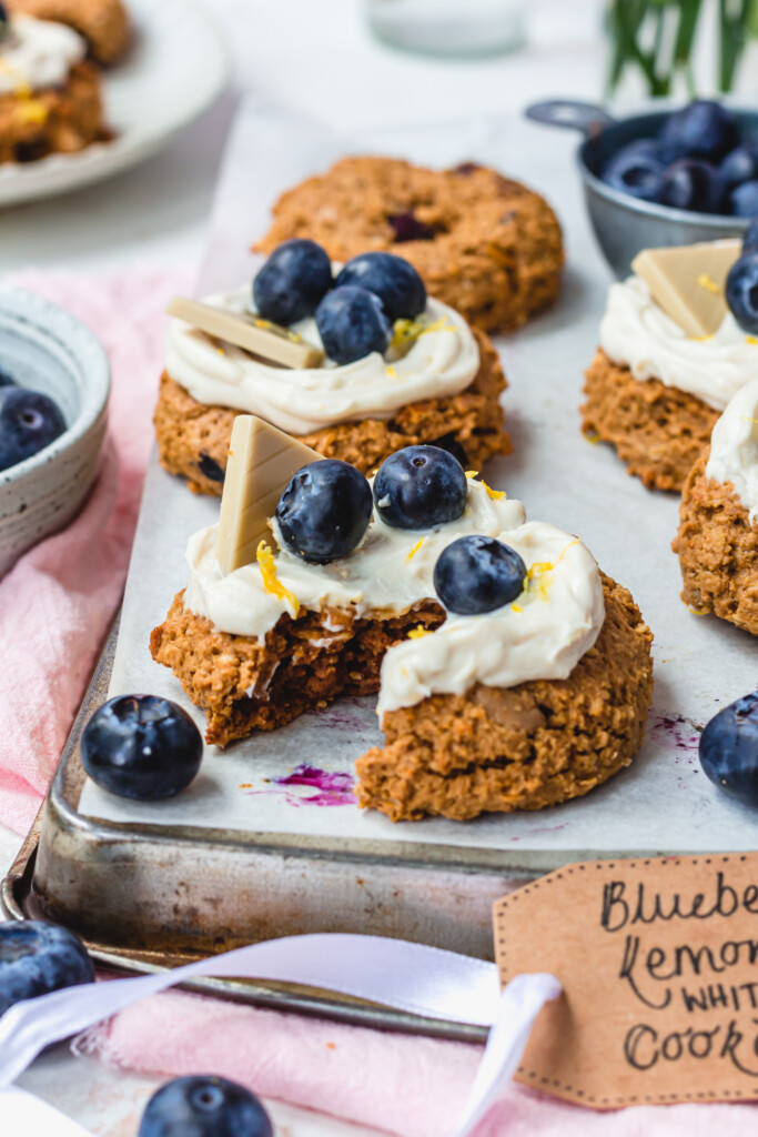 A broken Blueberry Lemon White Chocolate Oat Cookie on a tray