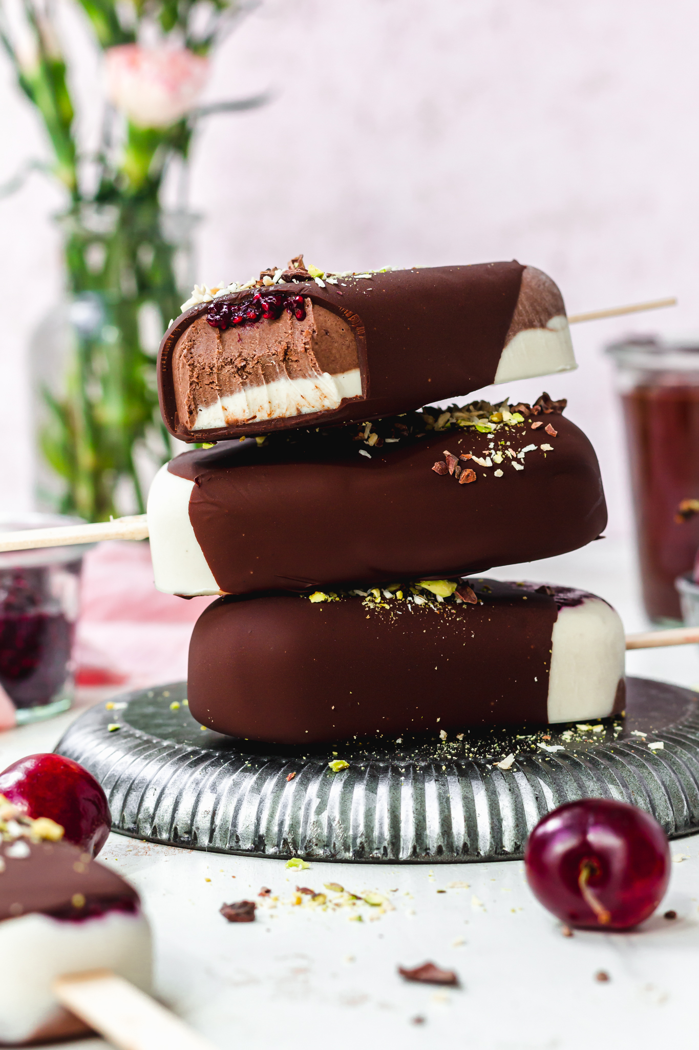 A stack of three Black Forest Magnum Ice Creams on a metal tray