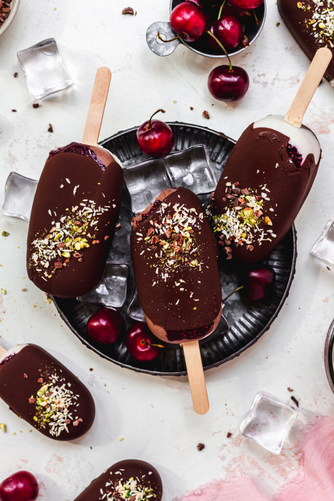 Three Black Forest Magnum Ice Creams in a metal tray with ice cubes