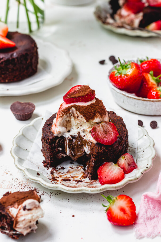 A Chocolate Strawberry Brownie Lava Cake on a plate with a melting middle