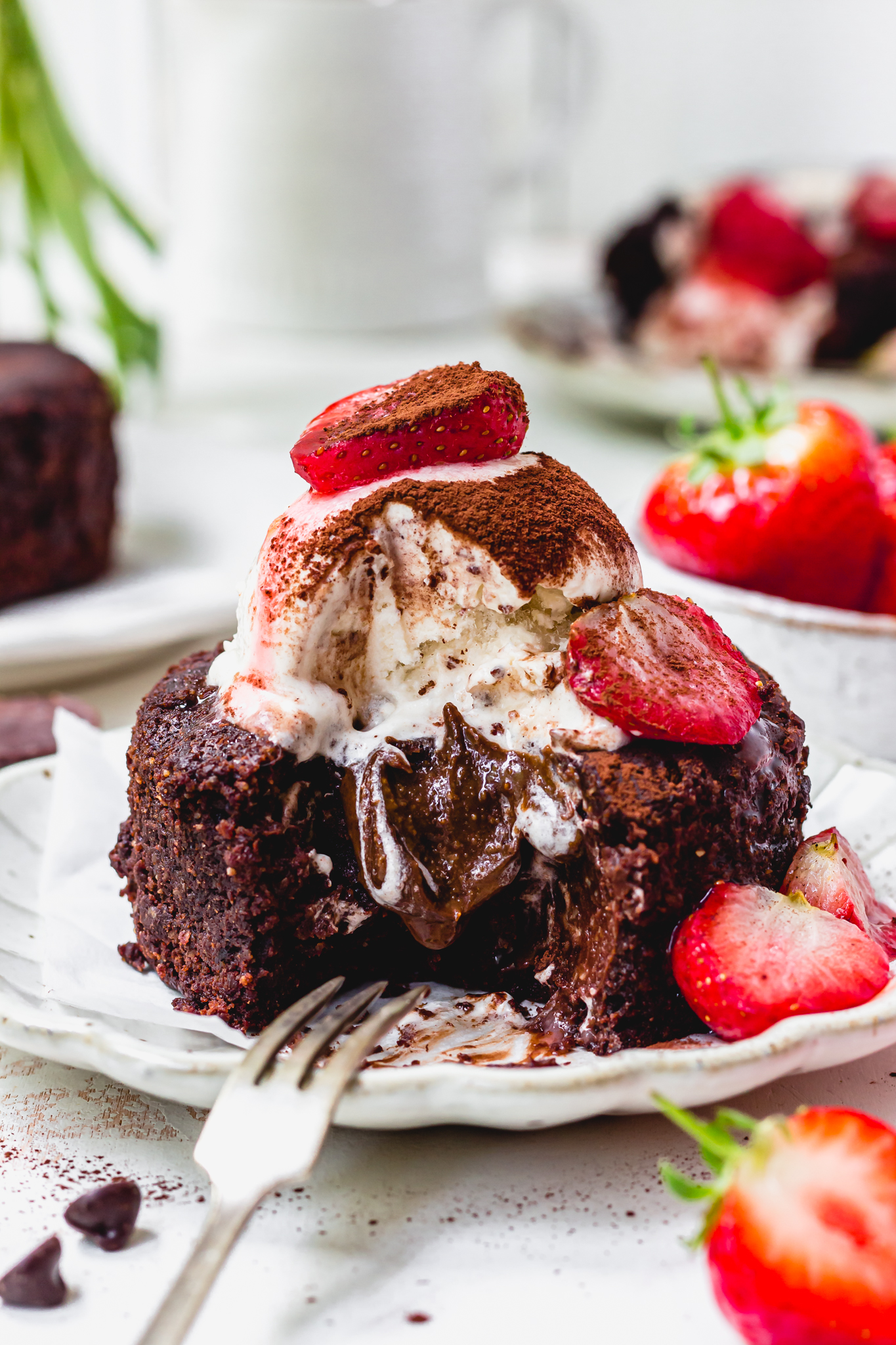 Close up of a Chocolate Strawberry Brownie Lava Cake with a fork