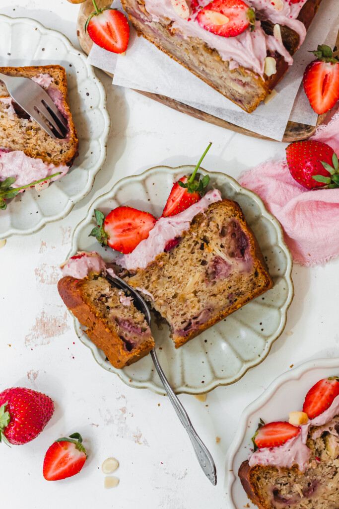 A fork and slice of Strawberry Almond Banana Bread on a small plate