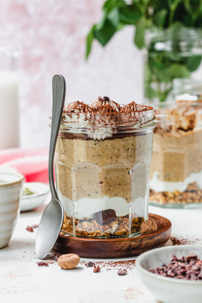 A spoon leaning against a jar of Tiramisu Blended Oats