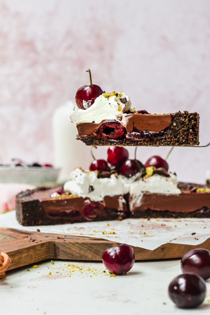 Lifting up a slice of Black Forest Chocolate Ganache Tart