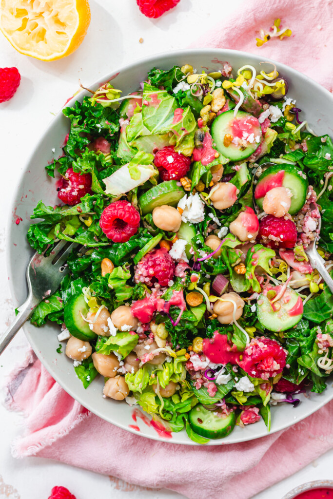 Close up of a salad with chickpeas and raspberries
