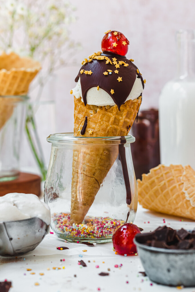 One Chocolate Cookie Dough Ice Cream Cone in a jar with a cherry on top
