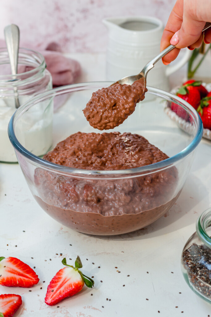 A bowl of chocolate chia pudding with a spoon