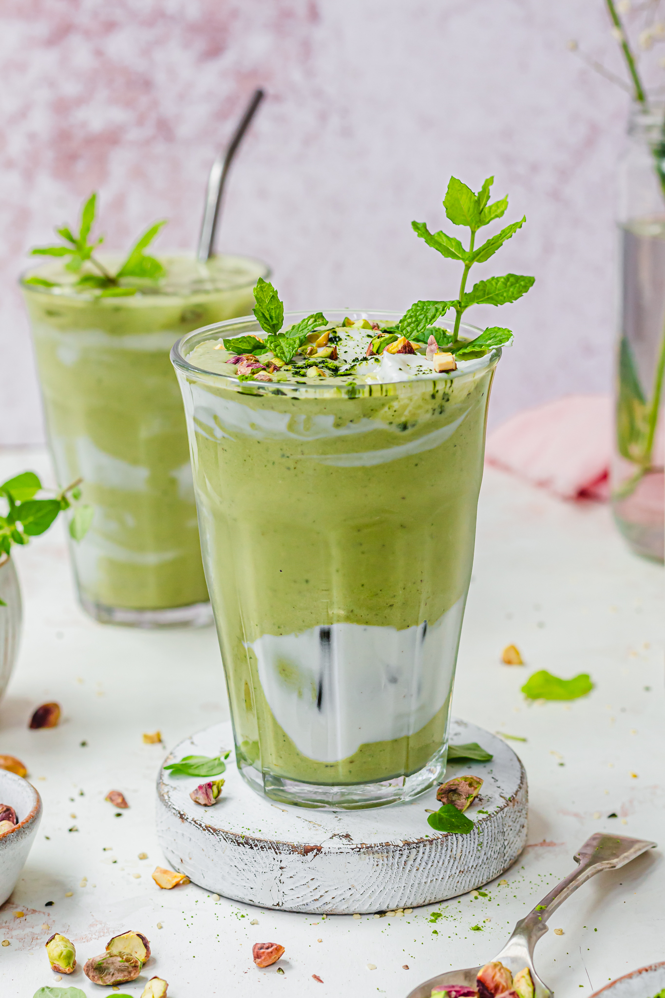 Iced Pistachio Matcha Mint Shake in two glass jars with straws