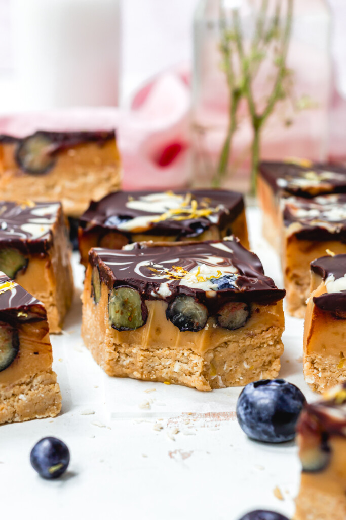 Some Lemon and Blueberry Chocolate Caramel Slices with fresh blueberries