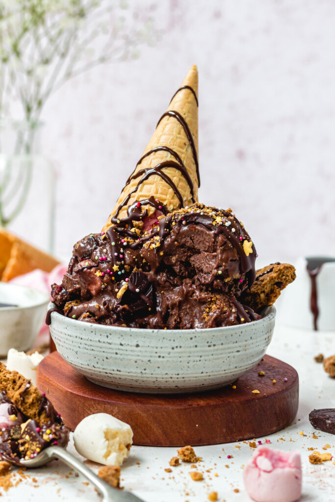 A small bowl with scoops of Rocky Road Ice Cream and a cone