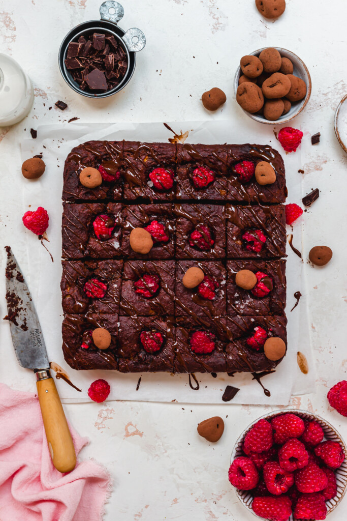 16 squares of chocolate brownie with raspberries