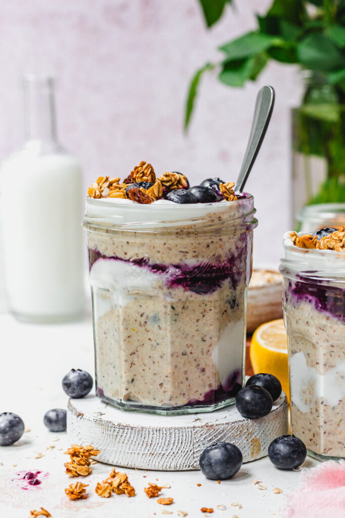 A jar of Lemon Blueberry Blended Oats with a spoon