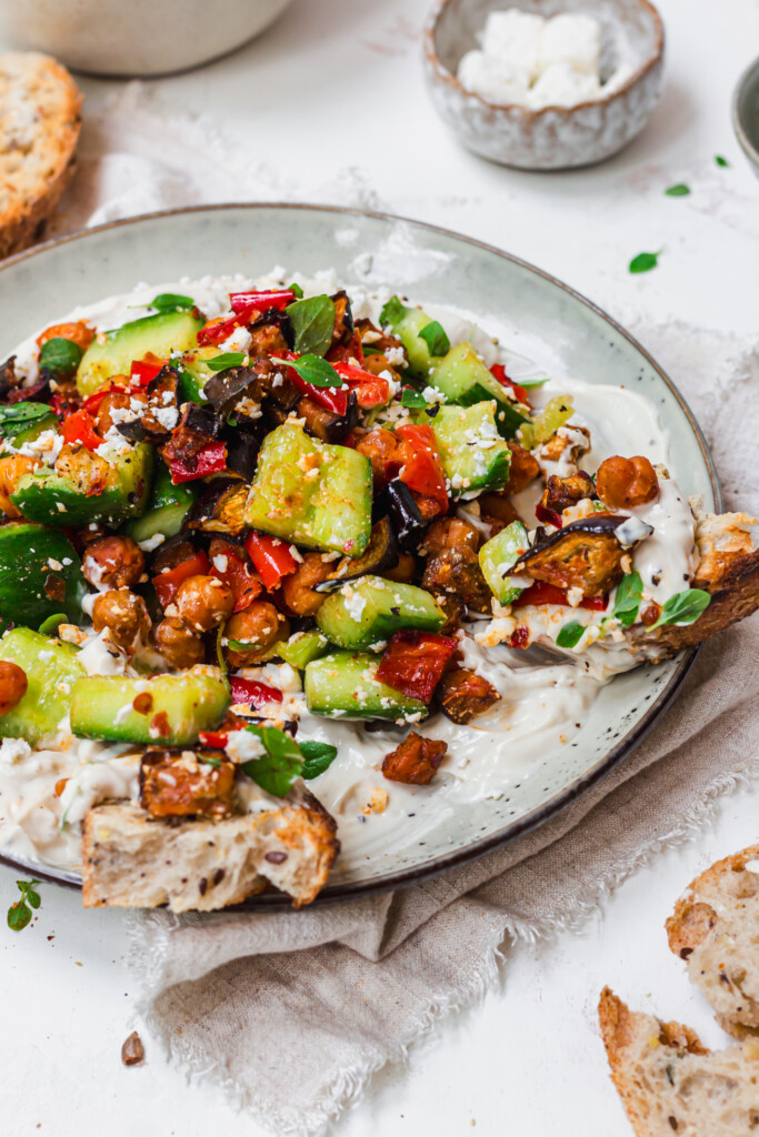 Roasted Aubergine and Chickpea Smashed Cucumbers with Whipped Tahini with bread