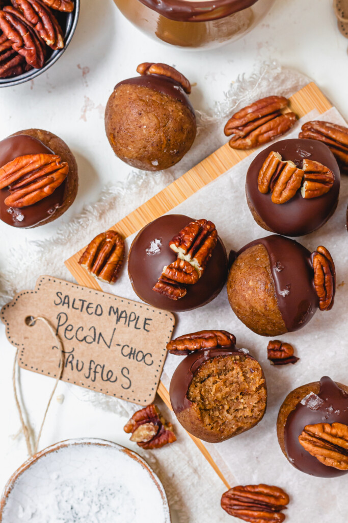 Some Salted Maple Pecan Chocolate Truffles with pecans on top