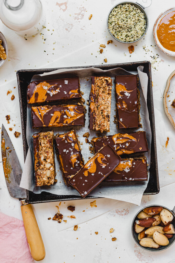 A metal tray filled with Banana Nut Chocolate Flapjack with peanut butter swirls
