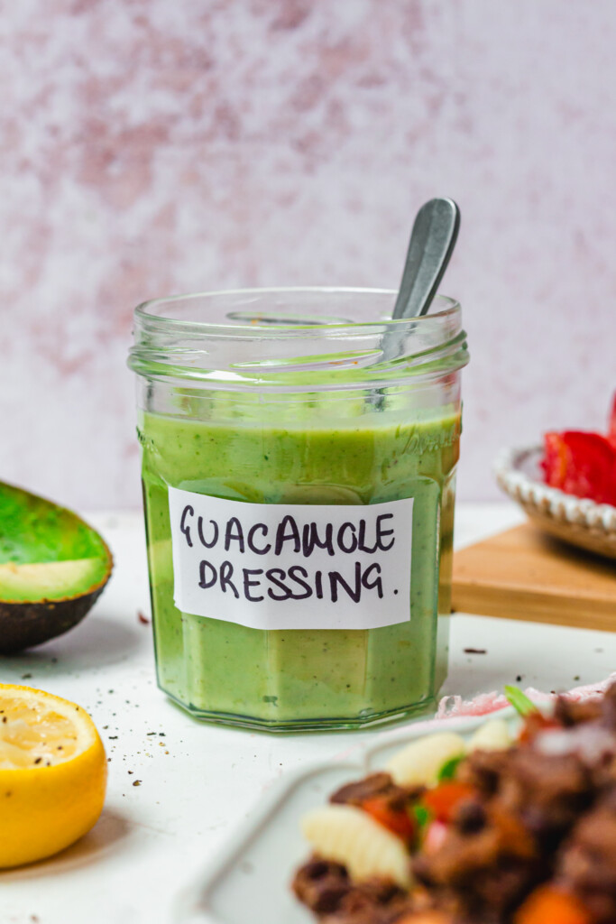 Guacamole Dressing in a jar with a label and spoon