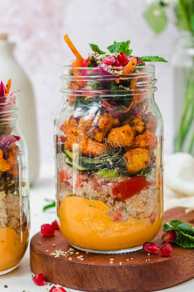 Close up of a jar of Harissa Tofu Tabouleh Salad