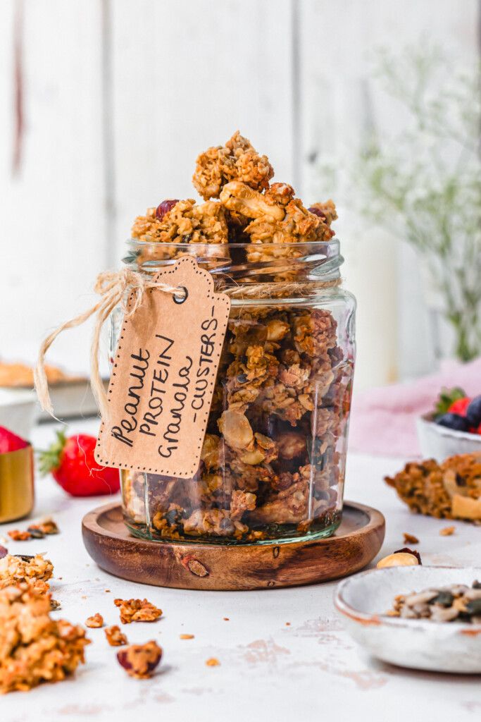 A jar of Peanut Butter Protein Granola Clusters with a lavel
