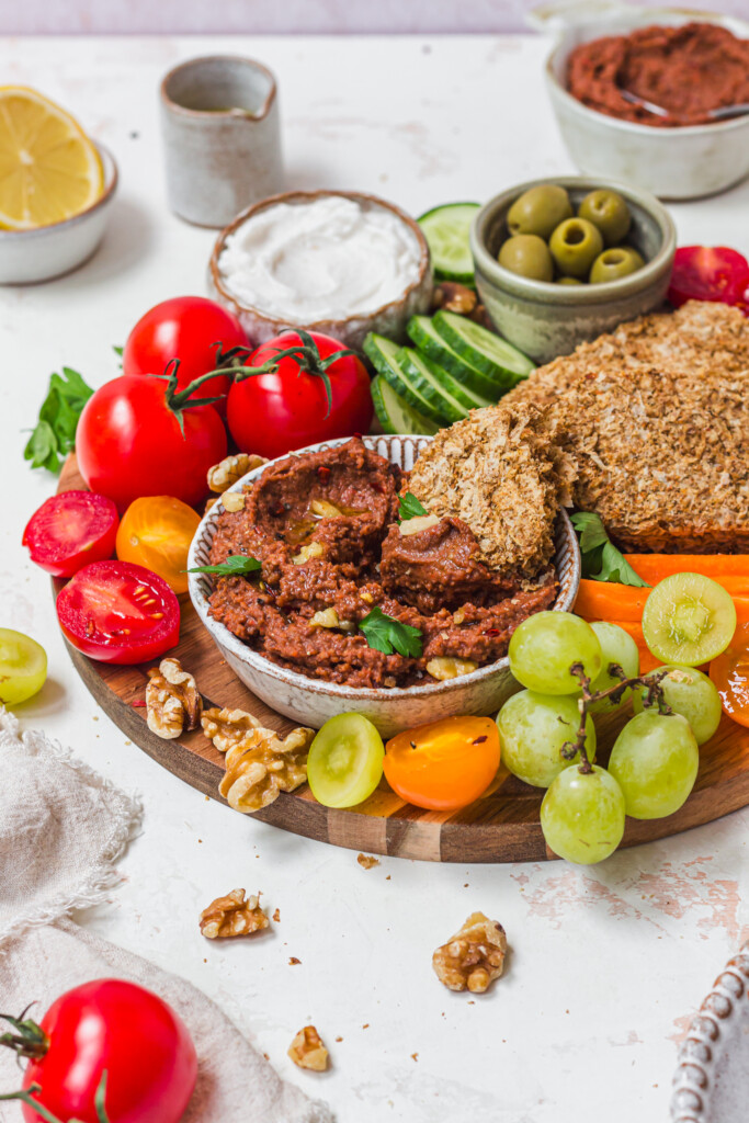 A board with veggies and Roasted Red Pepper Butterbean Weetabix Dip