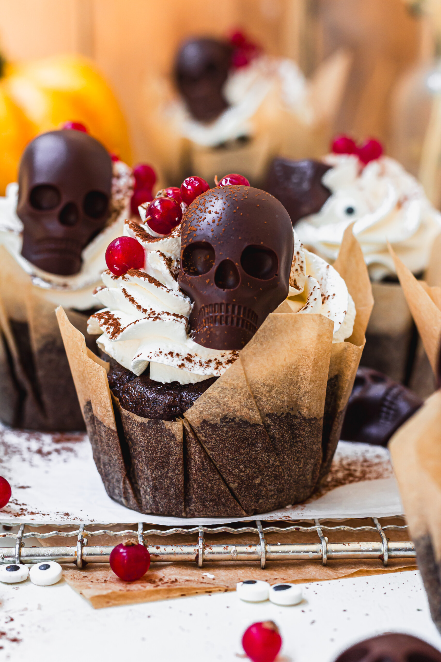 Close up of a Chocolate Berry Halloween Cupcake with chocolate skull