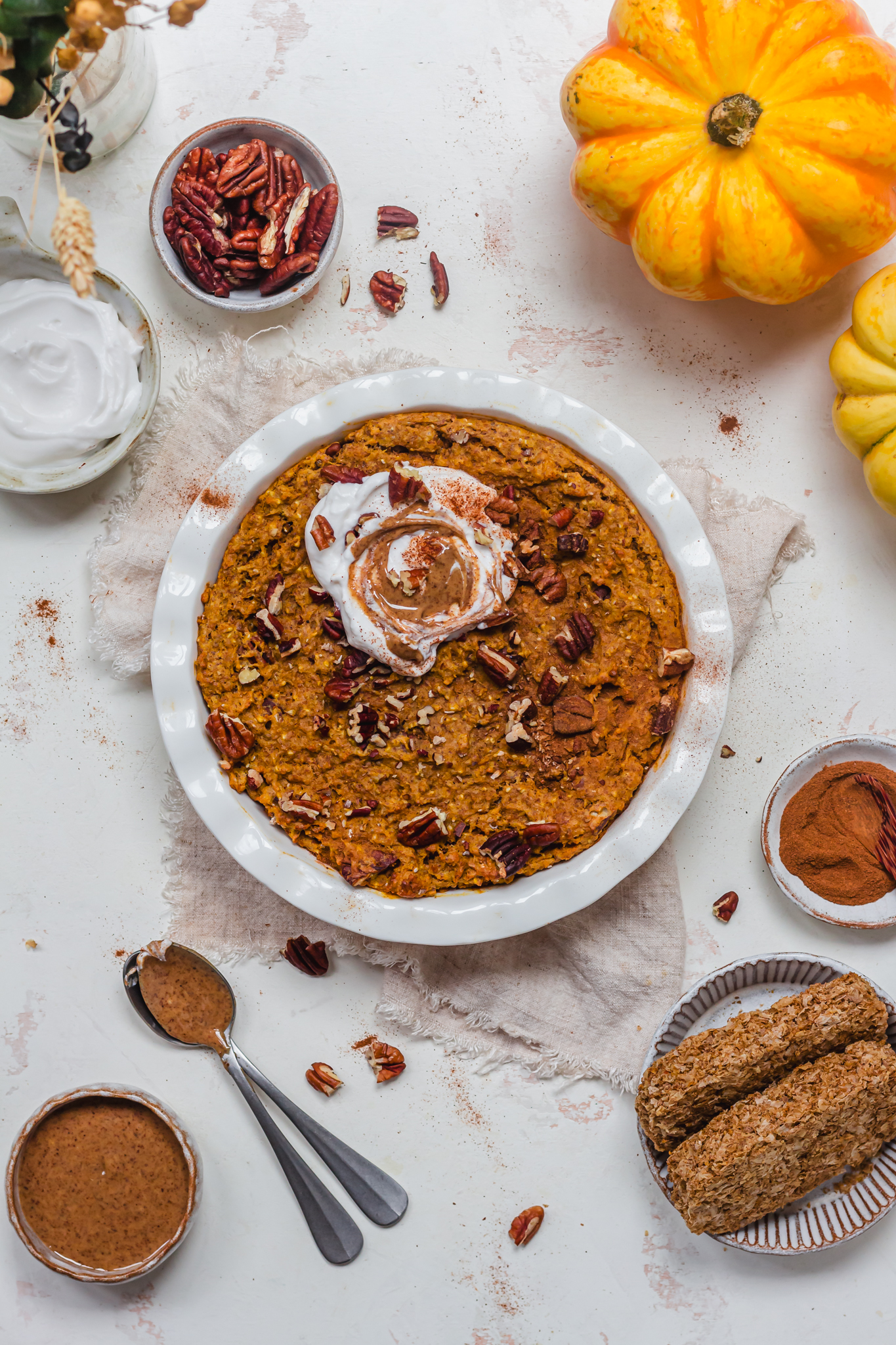 Pumpkin Baked Weetabix in a dish with two spoons